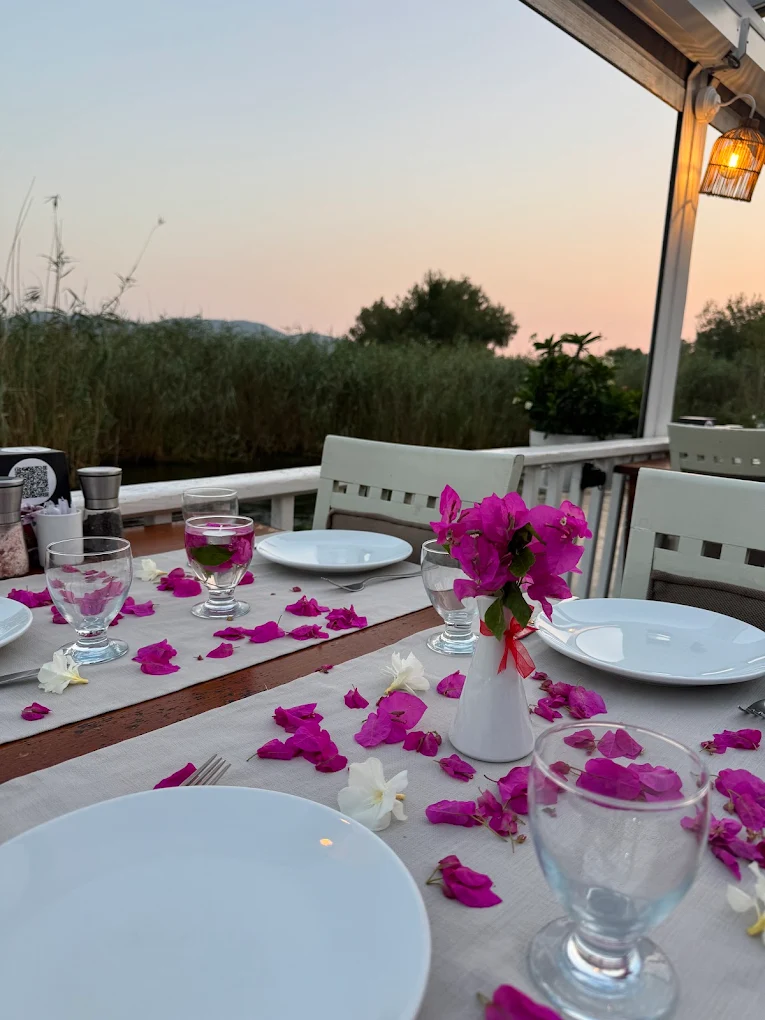 A waterside table prepared at Olta Restaurant
